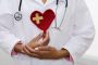 Doctor holding heart with bandage